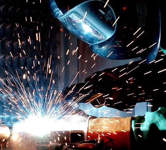 3. 4 Processes (Process based technologies). Exemplary Fields: Laser Technology, Microwave Technology, and Gas Metal Arc Welding (GMAW) Technology. Image: A worker usees a GMAW gun. A GMAW gun is an example of process based technolog. Source: NASA.